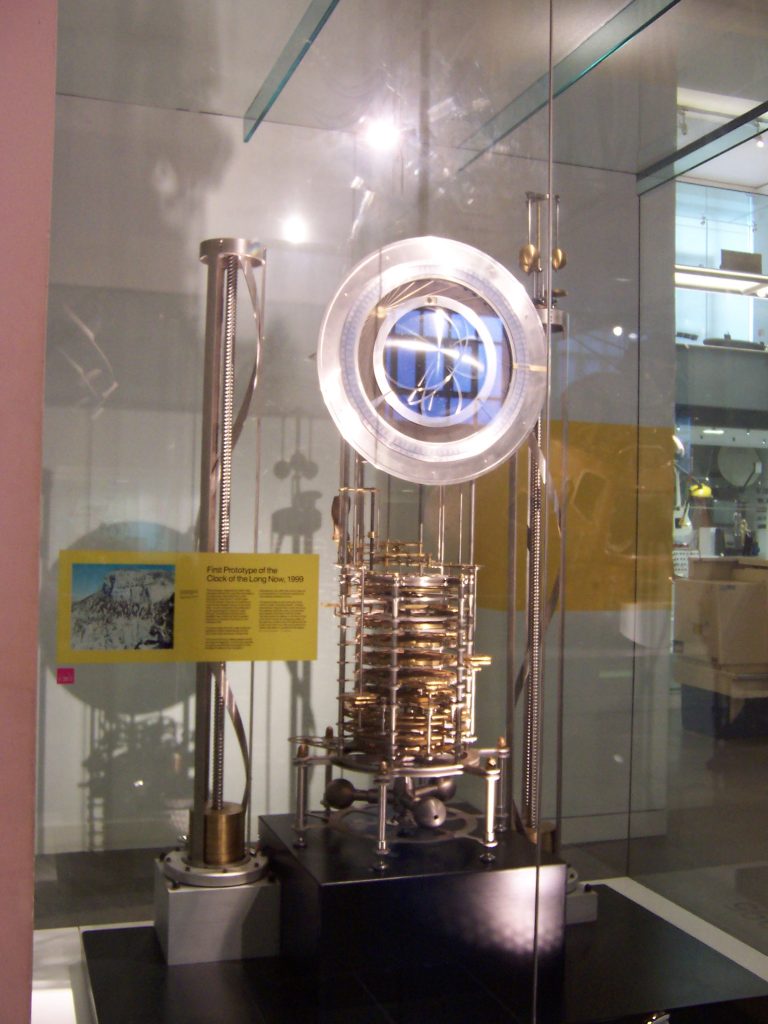 A mechanical clock on display in a museum.
