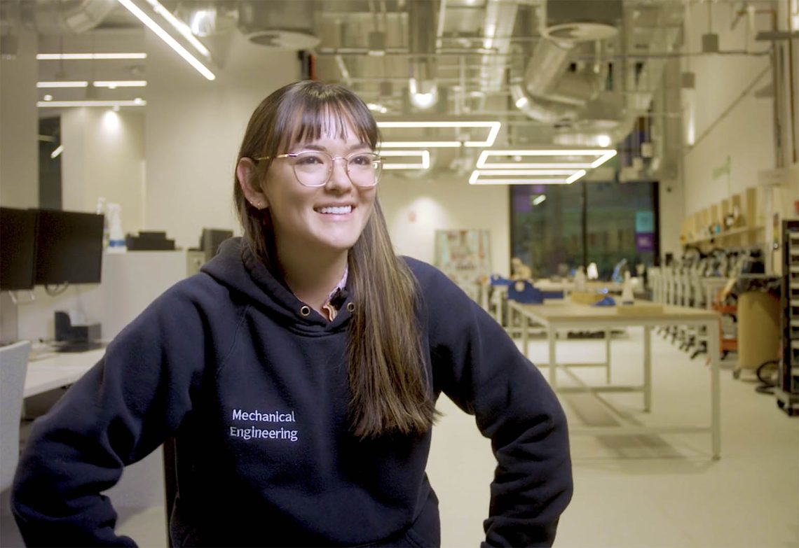 Grace Brown, mechatronics engineer, sitting in her lab