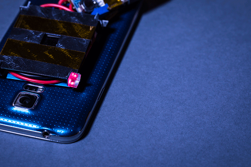 Illuminated in red is one of the 3-D printed retroreflectors, which reflects the low-power guard beams to diodes on the laser emitter