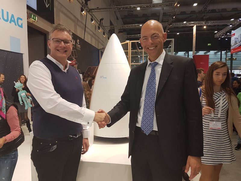 Holger Wentscher (right) and Stephen Bury (left), Chief Engineer of Gilmour Space, shaking hands upon the sound agreement between RUAG Space and Gilmour Space.
