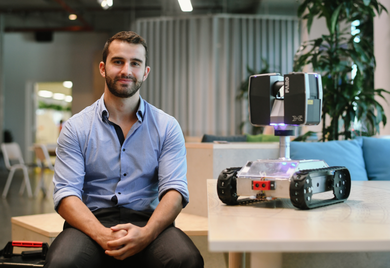 Most Innovative Engineer Daniel Messina with his autonomous scanning robot Hermes