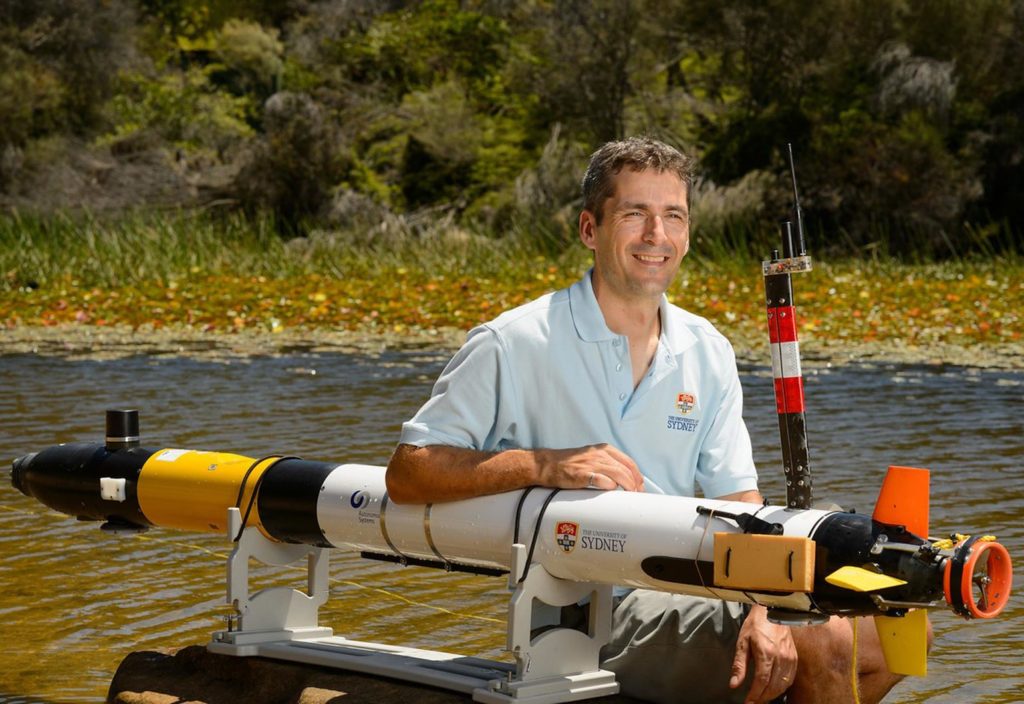 Professor Stefan Williams with an autonomous underwater vehicle