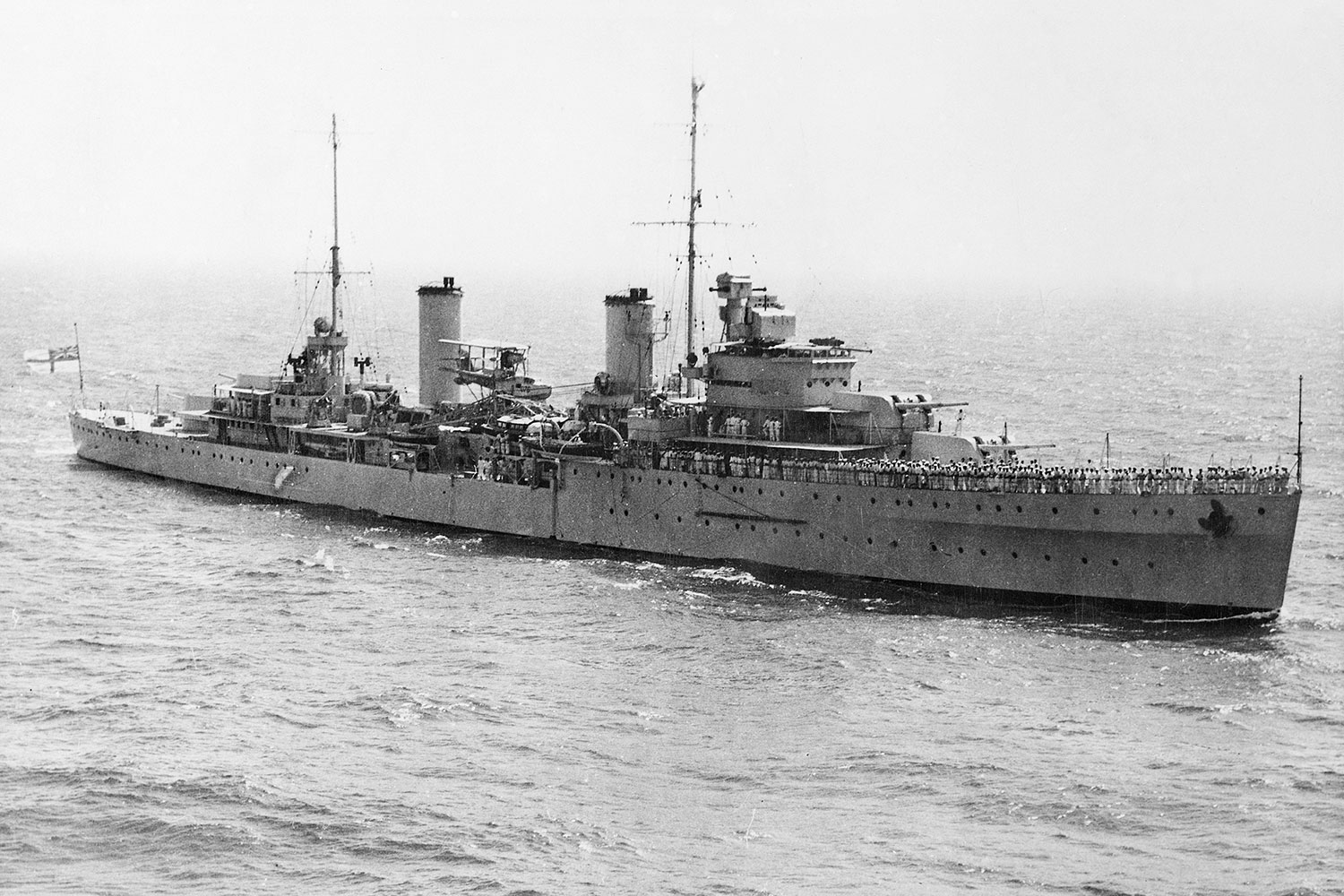 An aerial starboard bow view of the cruiser HMAS Sydney (II)
