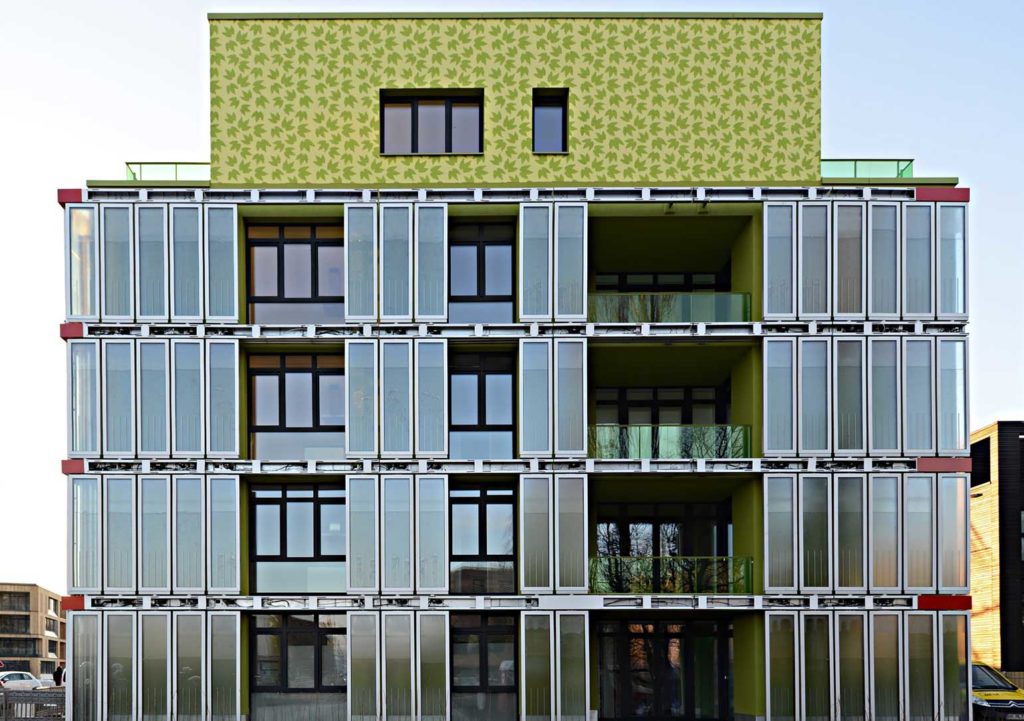 Hamburg's Bio Intelligent Quotient building uses panels filled with algae and water to generate solar thermal energy.