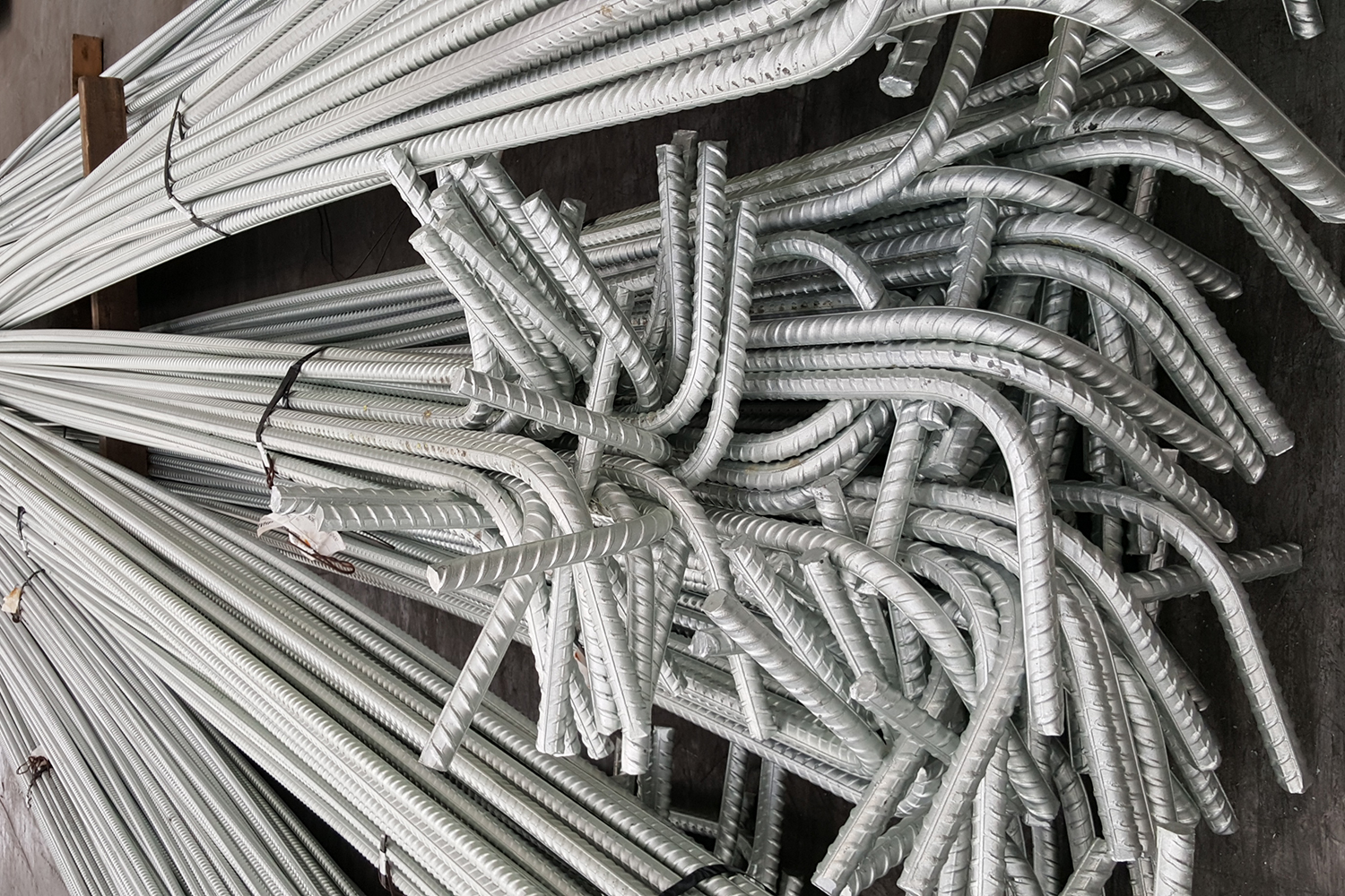 Hot dip galvanized reinforcement for increased durability in concrete construction.