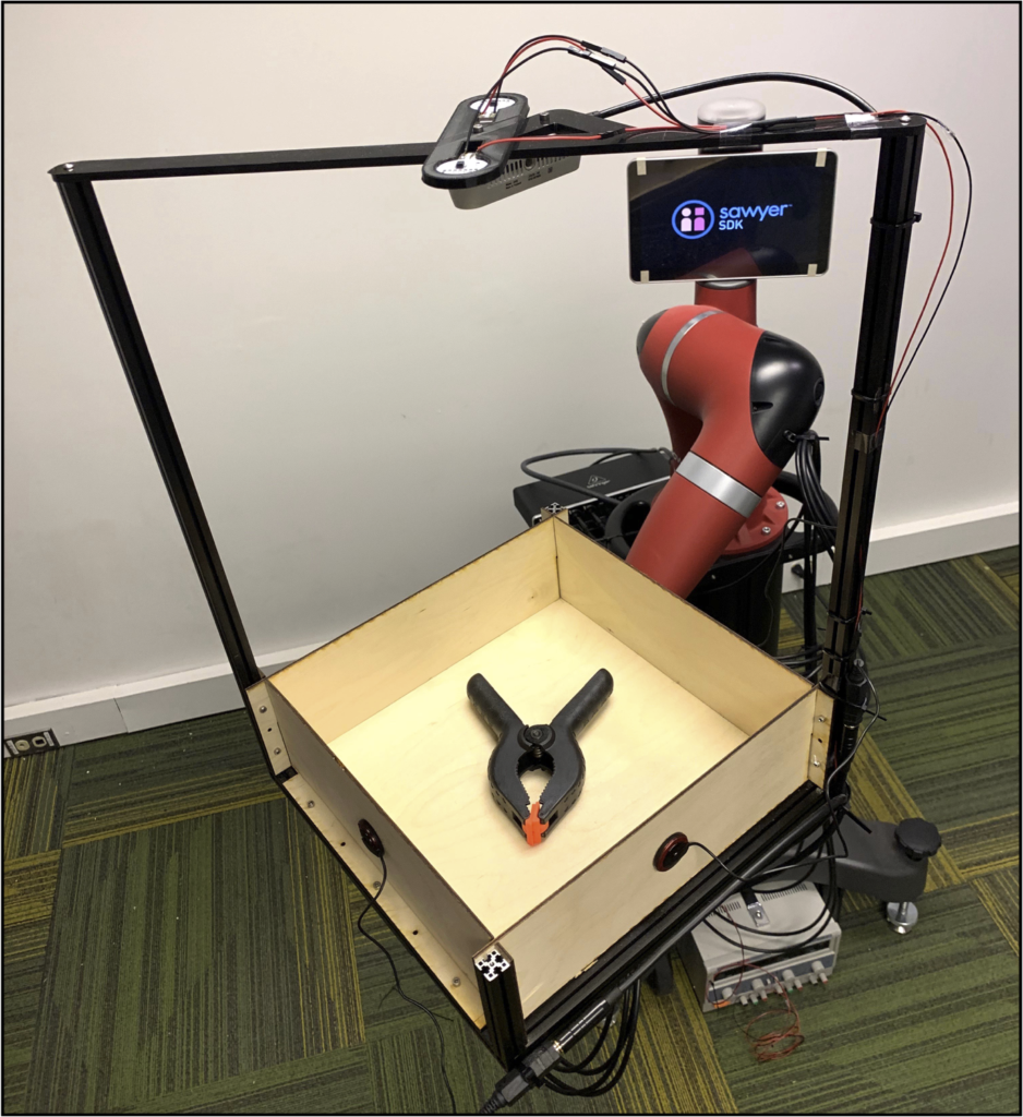 The researchers developed the Tilt-Bot, which is a square tray attached to the arm of a Sawyer robot.
