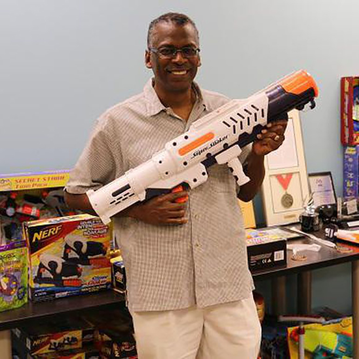 Then and now: Lonnie Johnson with his invention.
