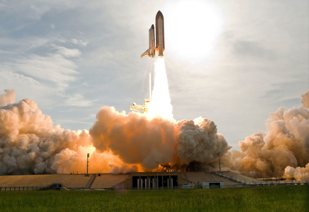The Space Shuttle Endeavour lifting off from Kennedy Space Center.