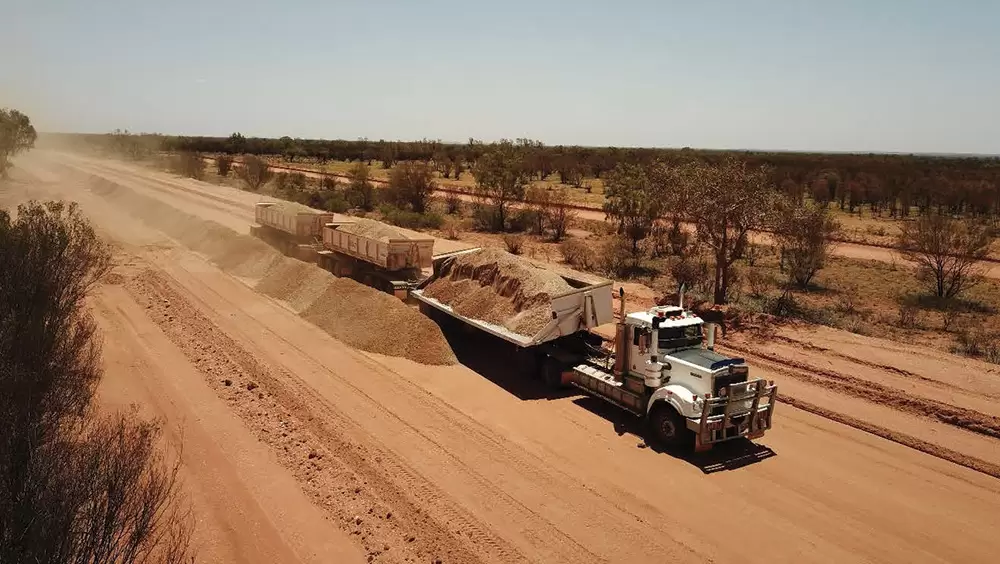 February: Grading and rolling the surface.