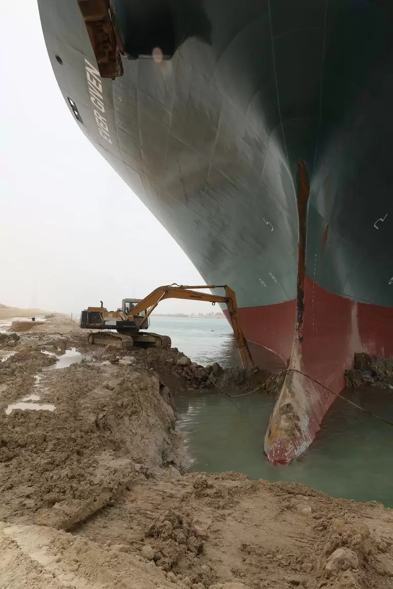 Initial attempts to dislodge the ship included using a digger to excavate the bow