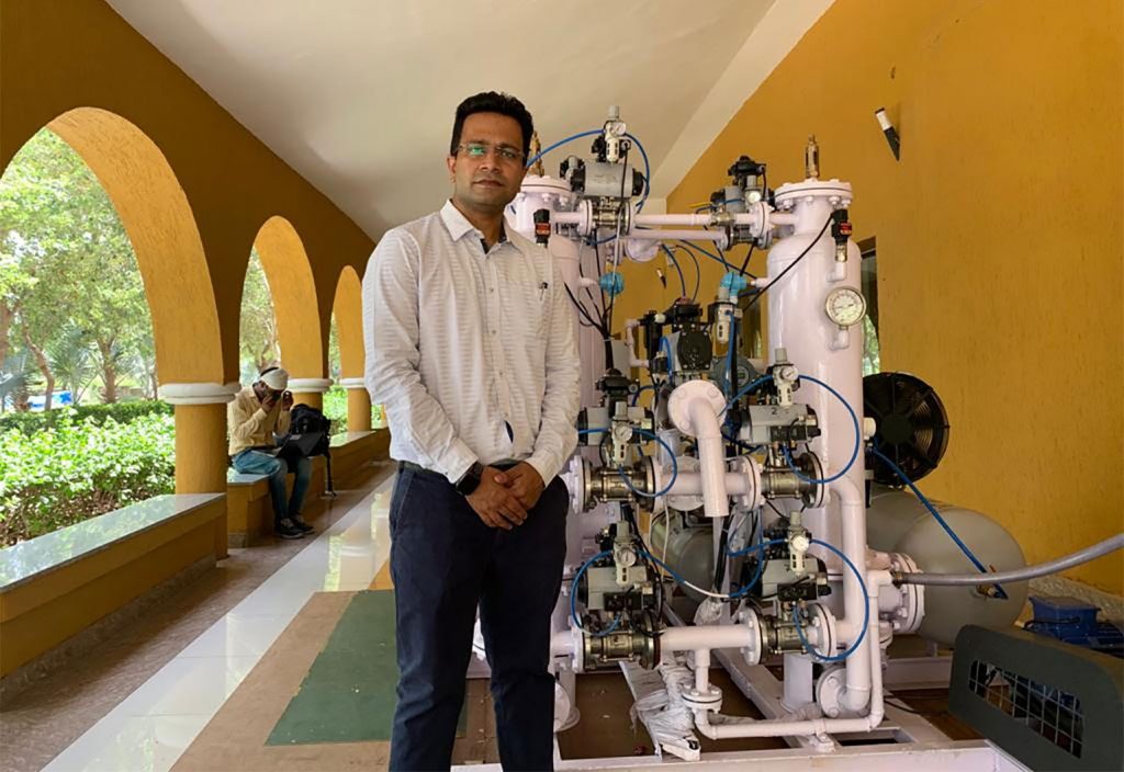 Manipal University Jaipur's Professor Abhhishek Sharma with the oxygen conversion unit.