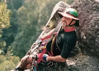 Alan Sheehan sitting on the edge of Kanangra Falls.