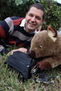 Robert Ross with WomBot the wombat robot.