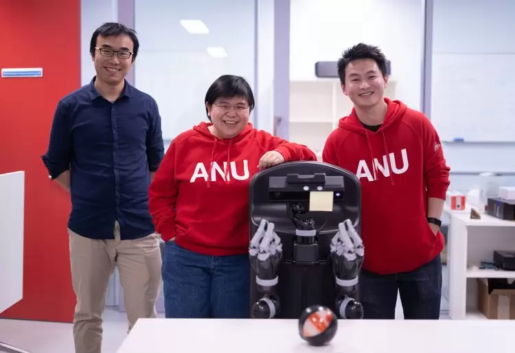 Robotics researcher Hanna Kurniawati (centre) at ANU.