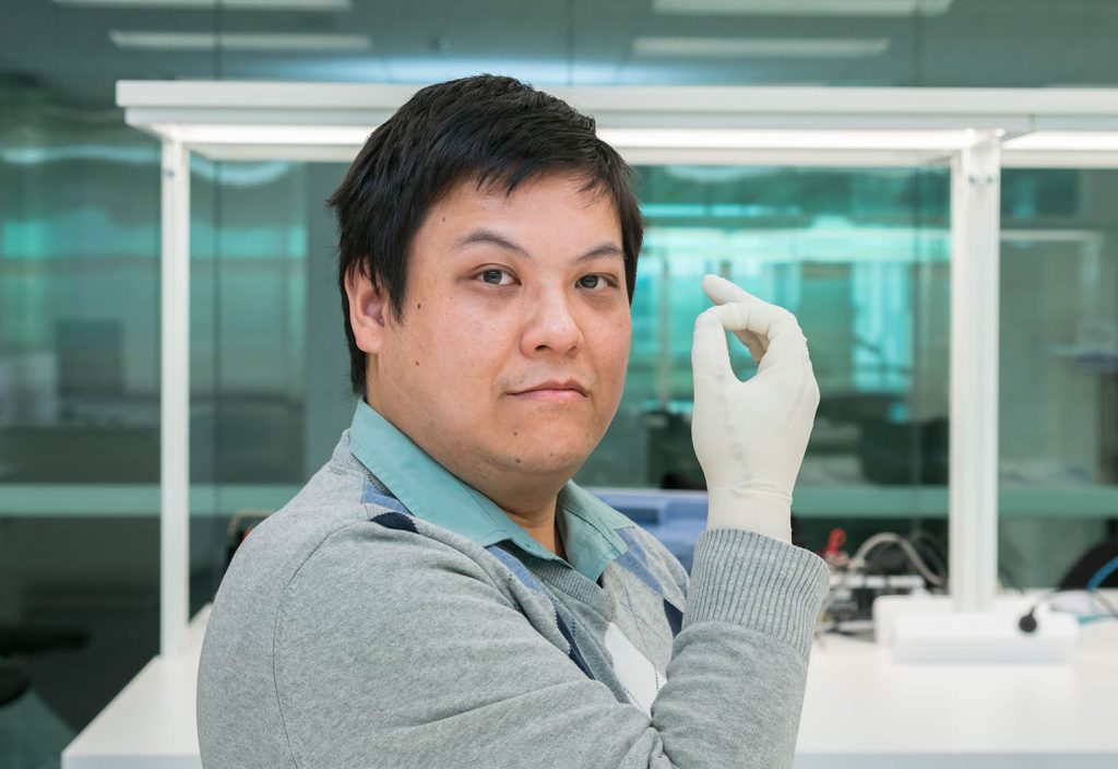 Dr Gough Li wearing one of his electronic surgical training gloves.
