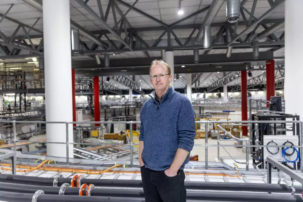 An image of Brad Mountford standing within a factory environment.