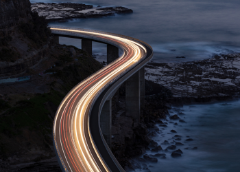 Sea Cliff Bridge, a balanced cantilever bridge south of Sydney, at night.