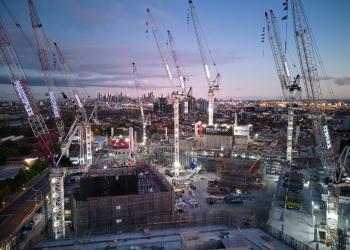 The Footscray Hospital under construction in the early afternoon, featuring almost 10 cranes pointing up to the sky.