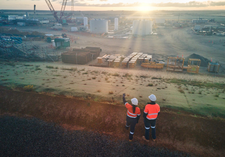 A pair of workers look out over the Waitsia Gas Project.